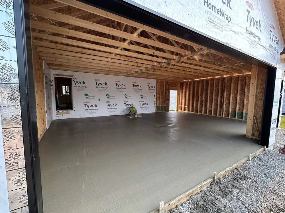 Freshly finished garage floor slab on a new-construction home